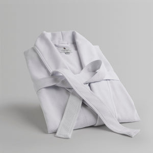Light gray luxury bathrobe on a light gray background