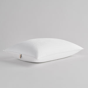 White pillow on a gray background