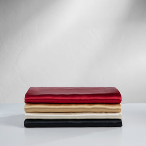Picture of 4 folded satin bed sheets