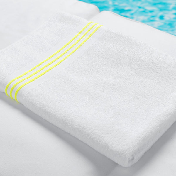 photo of best pool towel with neon yellow border stripes